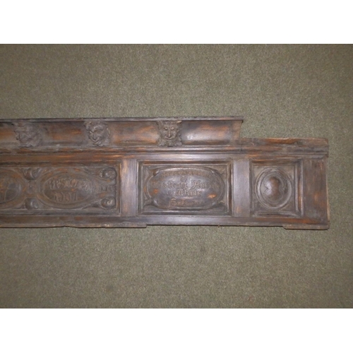 88 - An Edwardian carved oak frieze, the (incomplete) cornice applied with a series of male masks resembl... 