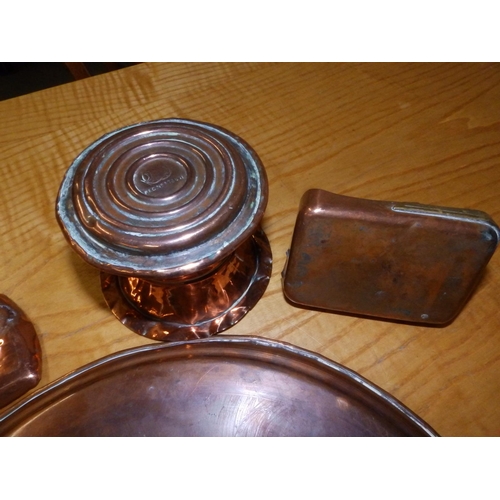 92 - A circular Arts & Crafts copper tray and three other pieces. (4)