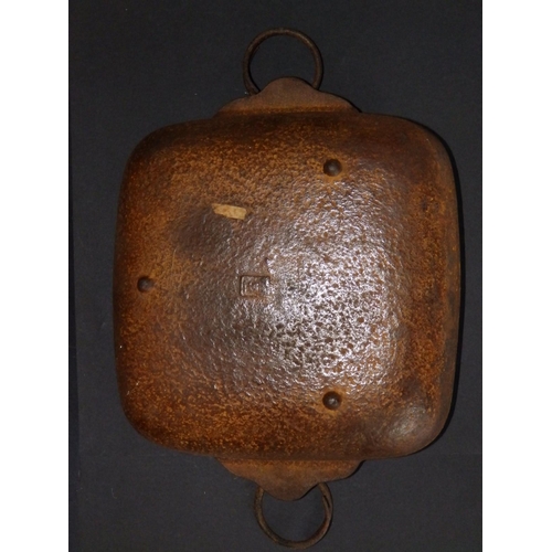 97 - An Oriental rectangular iron dish, seal mark to underside,  10