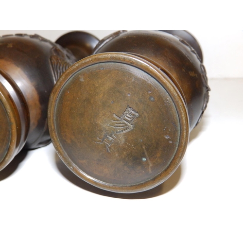 98 - A pair of Oriental bronze vases, signed to undersides. (2)