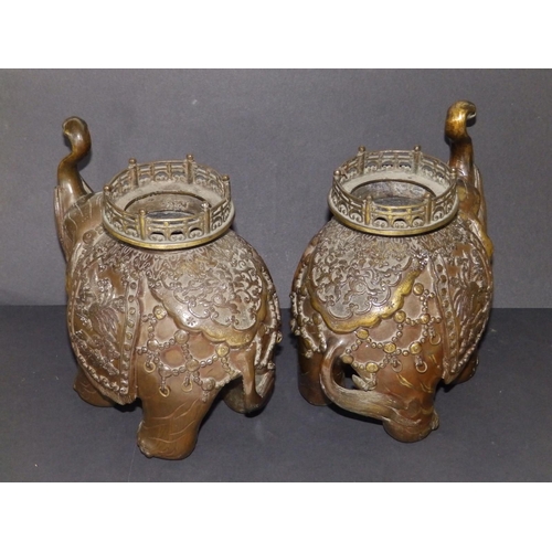 99 - A pair of Chinese bronze elephant incense burners, 10.5