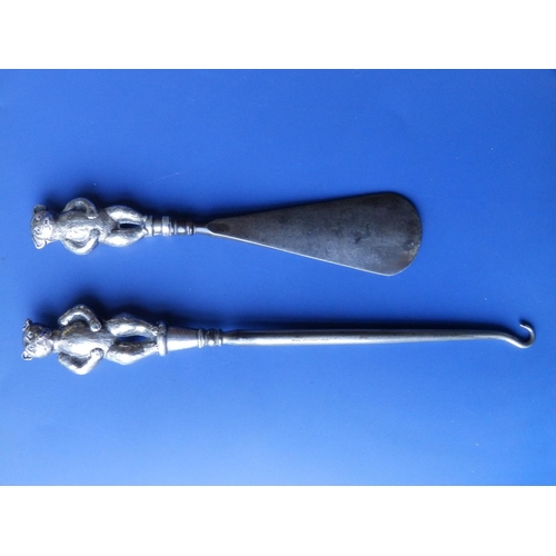 142 - A buttonhook and shoehorn with silver teddy bear handles - C&N, Birmingham 1909, 8.2