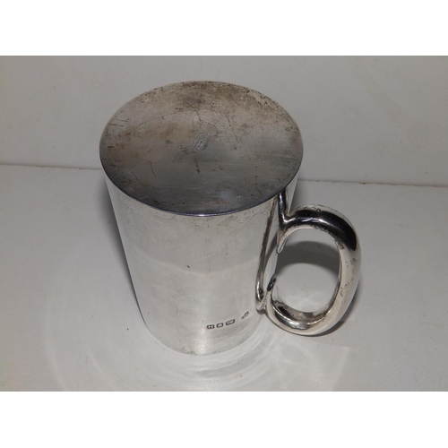 150 - A plain silver tankard of tapering cylinder form retailed by Harrods - RWB, London 1943, 4.75