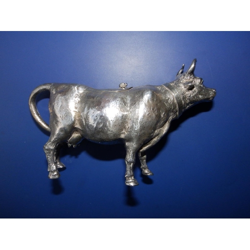 153 - A Berthold Muller silver cow creamer, naturalistically modelled, wearing a collar, an insect finial ... 