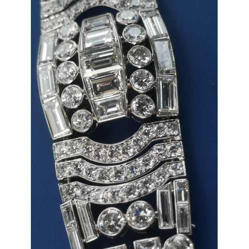 200 - An art deco diamond set tapering panel bracelet, of openwork form having numerous collet set round &... 