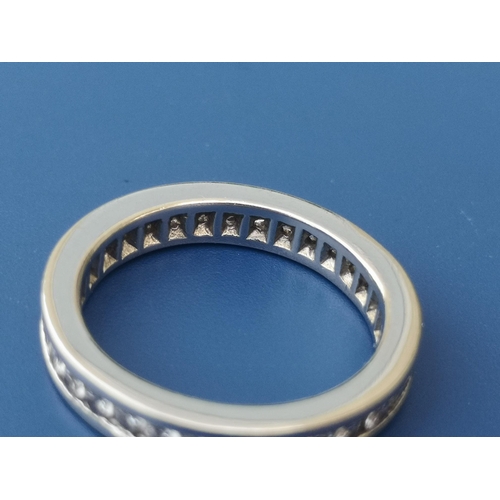 204 - A diamond set white metal eternity ring.  Finger size L.