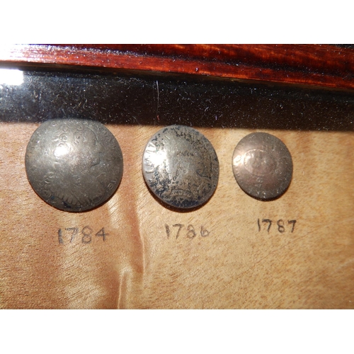 124a - A small framed display of ten 18thC Danish metal buttons, including Frederick IV examples - rubbed, ... 