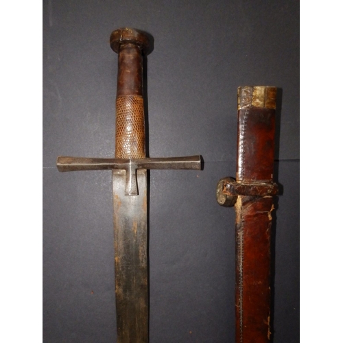 127 - A late 19thC Kaskara sword with leather hilt & scabbard, the blade 25