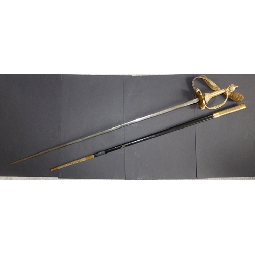 128 - An Edwardian court sword with gilt hilt and decorated blade in (repaired) leather scabbard, the blad... 