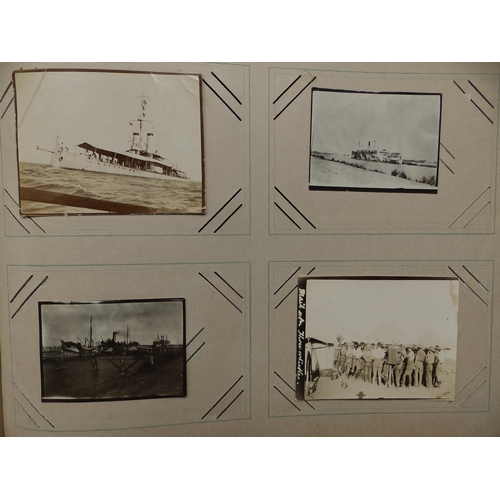 29 - An old postcard album containing various postcards and photographs mainly of military interest, earl... 