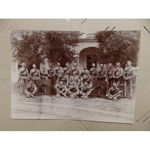 29 - An old postcard album containing various postcards and photographs mainly of military interest, earl... 