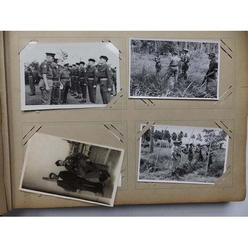 29 - An old postcard album containing various postcards and photographs mainly of military interest, earl... 