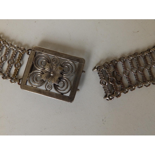 160 - A Malaysian Chinese white metal belt, of open link form with flowerhead to buckle,  33