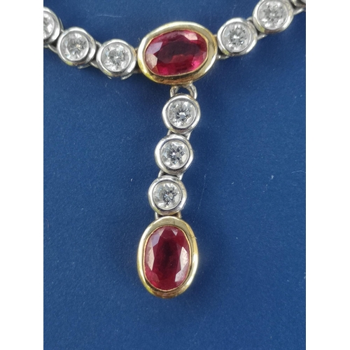 175 - A modern ruby & diamond set necklace in 18ct white & yellow gold, comprising six oval cut rubies in ... 