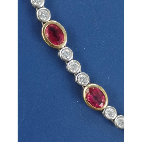 175 - A modern ruby & diamond set necklace in 18ct white & yellow gold, comprising six oval cut rubies in ... 