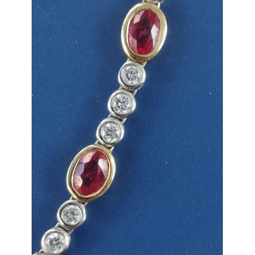 175 - A modern ruby & diamond set necklace in 18ct white & yellow gold, comprising six oval cut rubies in ... 