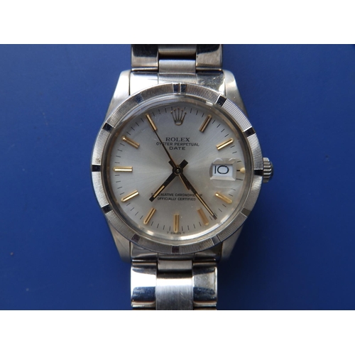 313 - A boxed gent's stainless steel Date wrist watch, with silver dial haviung gold baton markers on Oyst... 