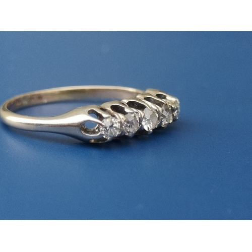 186 - A small five stone old cut diamond ring on 18ct shank.  Finger size M/N.