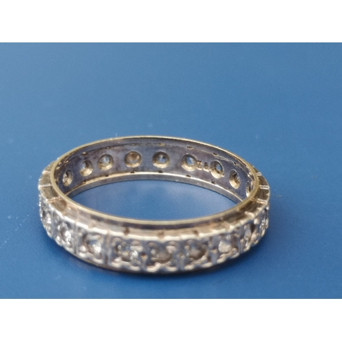 194 - A diamond set yellow & white metal '18' eternity ring.  Finger size N/O.