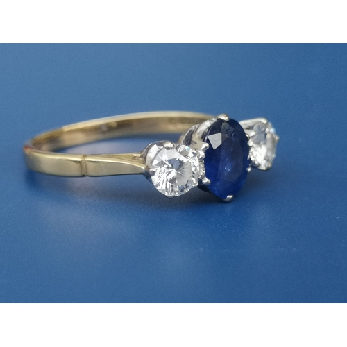 199 - A three stone sapphire & diamond ring on 18ct gold shank, London marks.  Finger size Q.