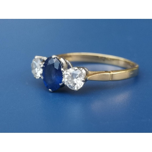 199 - A three stone sapphire & diamond ring on 18ct gold shank, London marks.  Finger size Q.