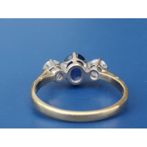 199 - A three stone sapphire & diamond ring on 18ct gold shank, London marks.  Finger size Q.