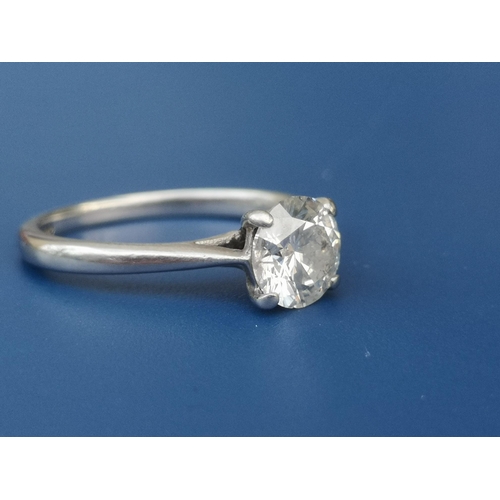 208 - A diamond solitaire ring, the four claw set brilliant weighing approximately one carat, on platinum ... 