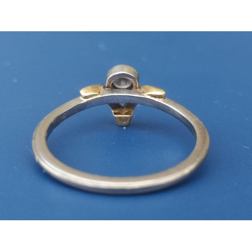 212 - A small diamond collet set 18ct gold solitaire ring in wishbone setting.  Finger size K.