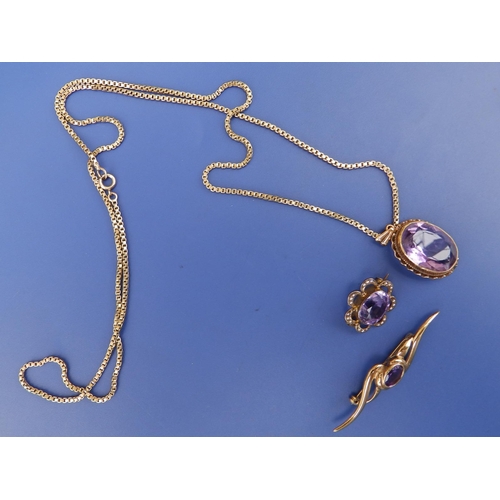 232 - An oval amethyst pendant on 9c box link necklace chain and two amethyst brooches. (3)