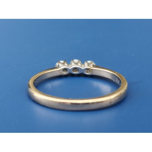 233 - A small three stone diamond set 9ct gold ring. Finger size P.