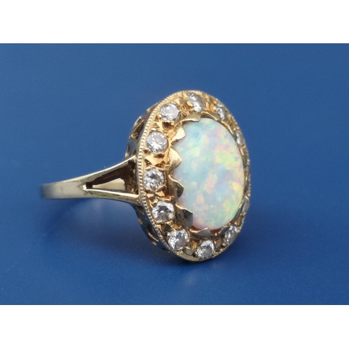 248 - An opal & diamond oval cluster ring on 18ct shank.  Finger size K/L.