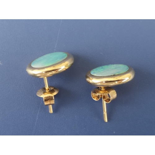 249 - A pair of oval opal panel earrings - 14K, 11mm overall.