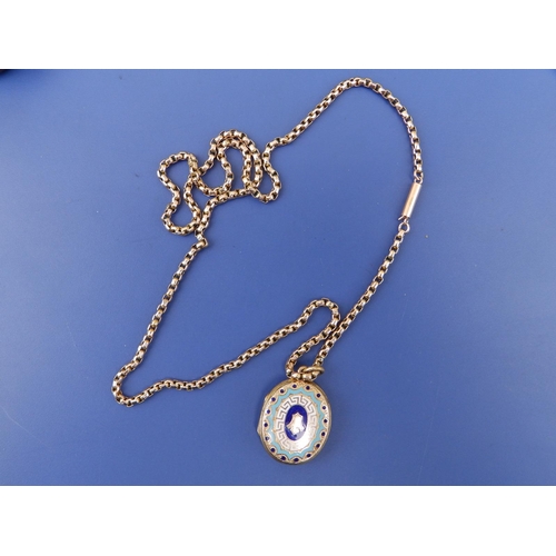 256 - An enamelled yellow metal oval locket on 9ct chain, the locket , 1