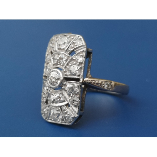 263 - An art deco diamond millegrain set 18ct white gold panel ring of open rectangular form, finger size ... 