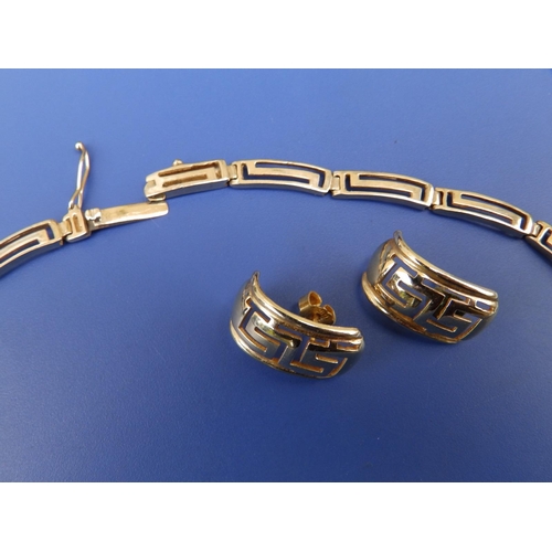 273 - An openwork Greek key pattern 14K necklace & matching earrings. (3)