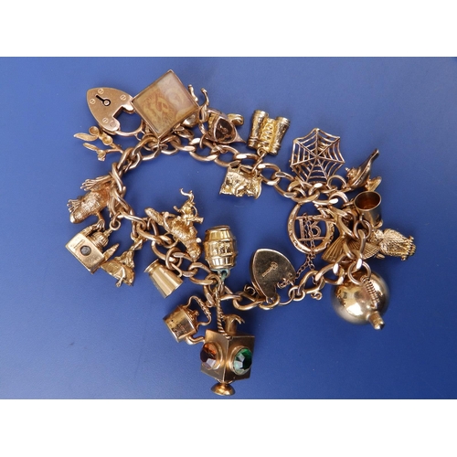 279 - A 9ct gold charm bracelet.