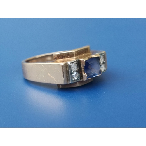 280 - An Egyptian sapphire & diamond set gold band ring of angular art deco form, the central rectangular ... 