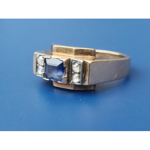 280 - An Egyptian sapphire & diamond set gold band ring of angular art deco form, the central rectangular ... 