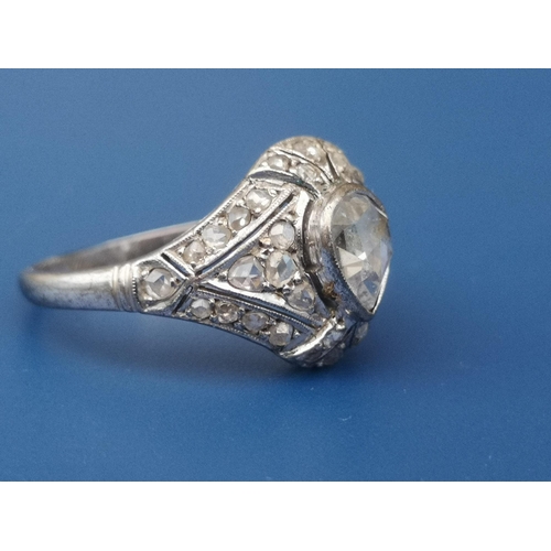 283 - A boxed Egyptian rose cut diamond cocktail ring, a central pear shaped stone surrounded by numerous ... 