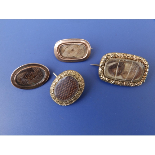 284 - Four 19thC hair-set yellow metal memorial brooches, the largest with cracked glass, 1.2