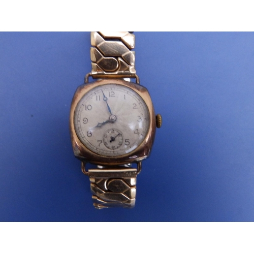 298 - An early 20thC gent's 9ct gold Leda wrist watch on plated strap - case bruised.