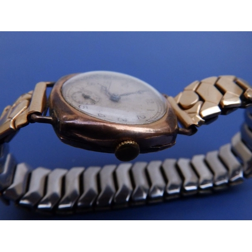 298 - An early 20thC gent's 9ct gold Leda wrist watch on plated strap - case bruised.