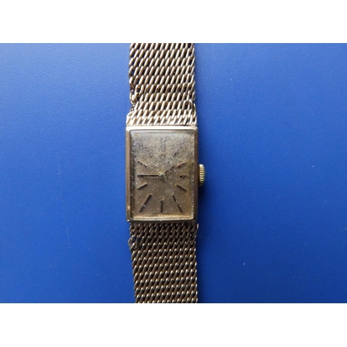 300 - A lady's 9ct gold Omega rectangular dial bracelet wrist watch - dial & bracelet a/f.