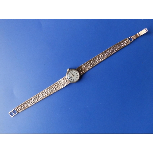 301 - A lady's 9ct gold Omega bracelet wrist watch - bracelet damaged.