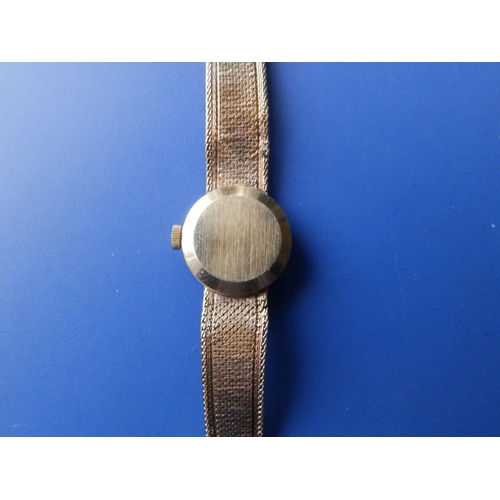 301 - A lady's 9ct gold Omega bracelet wrist watch - bracelet damaged.