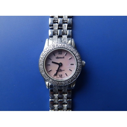 303 - A boxed lady's diamond set stainless steel Ingersoll Quartz bracelet wrist watch with mother-of-pear... 