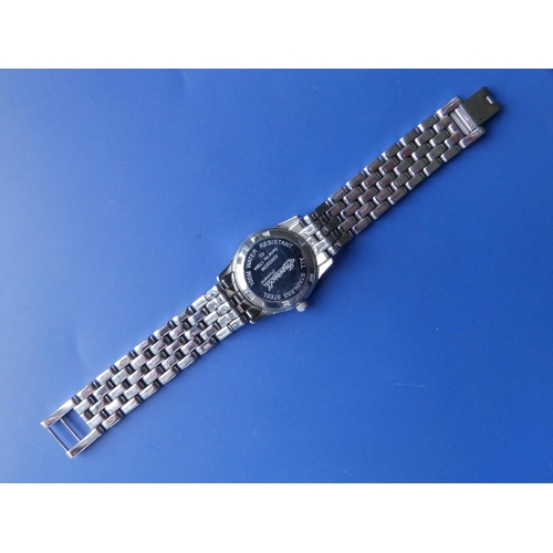 303 - A boxed lady's diamond set stainless steel Ingersoll Quartz bracelet wrist watch with mother-of-pear... 