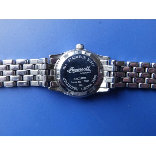 303 - A boxed lady's diamond set stainless steel Ingersoll Quartz bracelet wrist watch with mother-of-pear... 