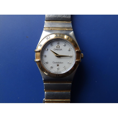 309 - A boxed lady's stainless steel & gold Omega Constellation bracelet wrist watch,  with mother-of-pear... 