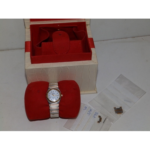 309 - A boxed lady's stainless steel & gold Omega Constellation bracelet wrist watch,  with mother-of-pear... 